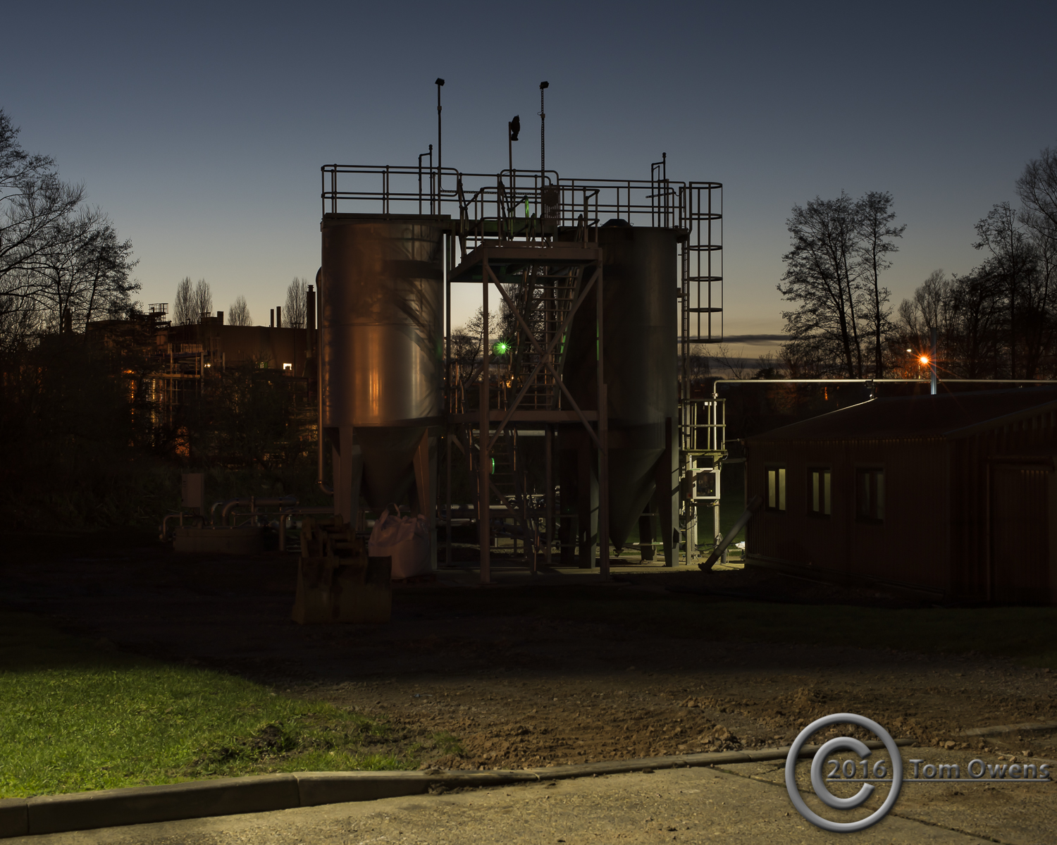 Industrial hoppers at night