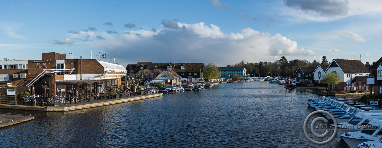 A view downriver from Wroxham Bridge at tea time