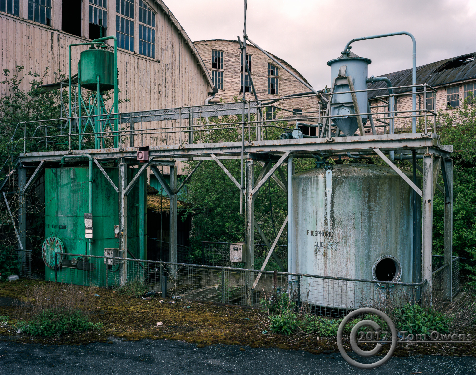 Potassium Hydroxide and Phosphoric Acid tanks in derelict factory