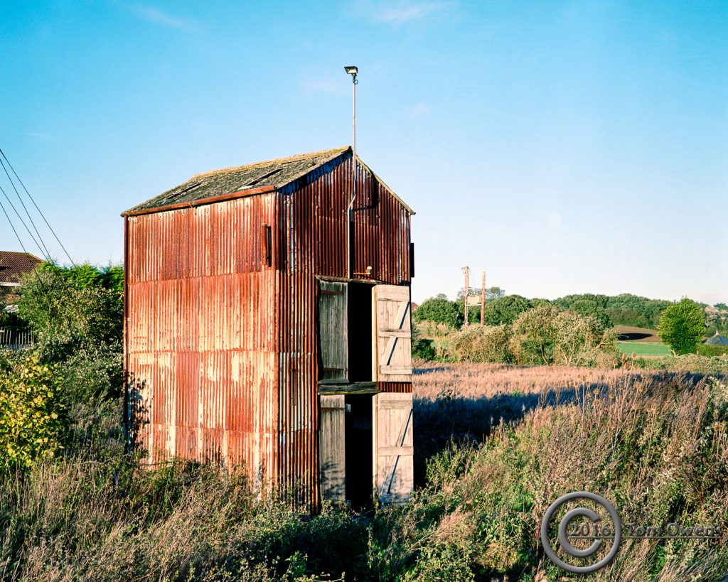 Corrugated rusty shed in late afternoon sun
