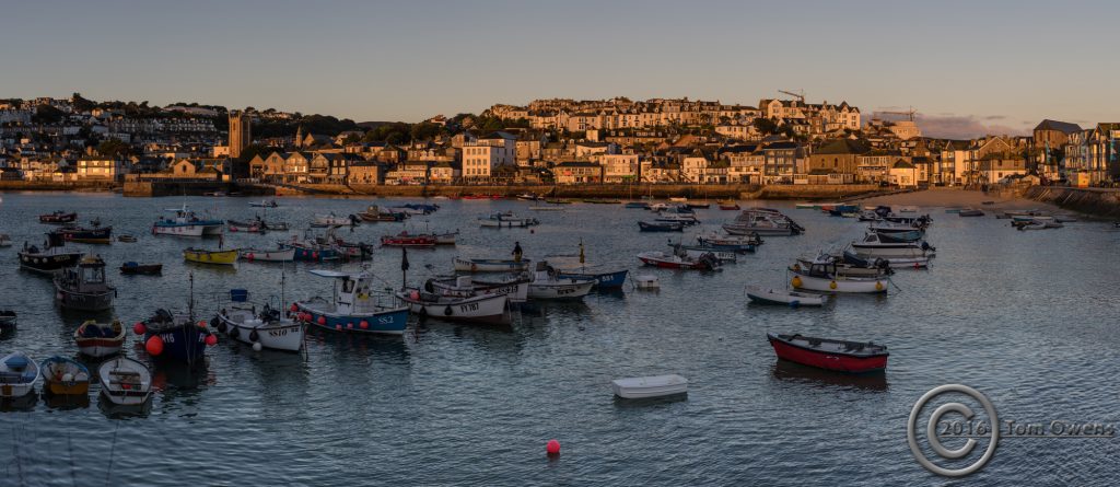 St Ives harbour boats and sunlit houses ten minutes after sunrise