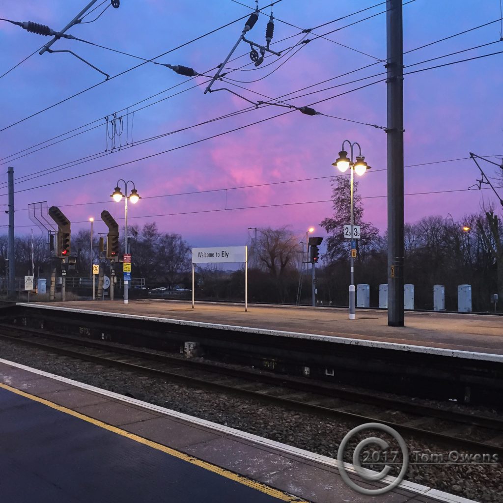 Red sunset clouds at Ely station