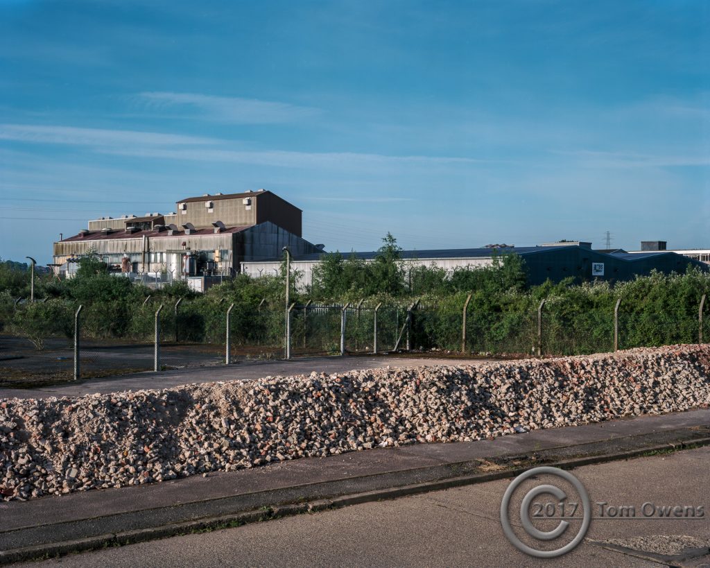 Rubble bund in fron of factory